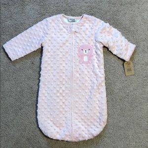 Soft pink zip up bag type outfit